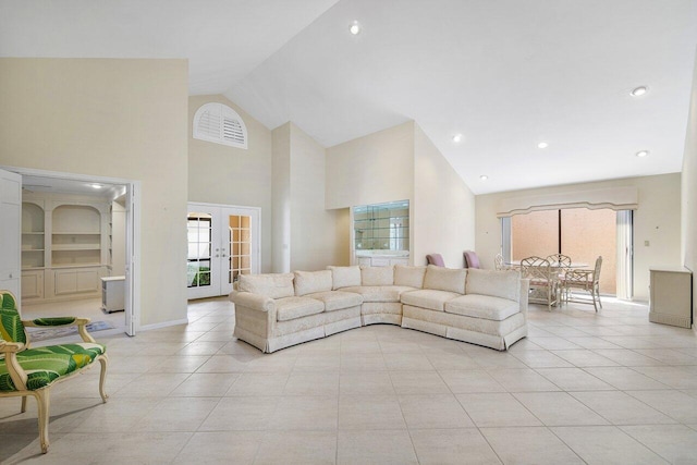 16703 Hidden Cove Dr, Jupiter, FL 33477 - living room with high vaulted ceiling, light tile patterned floors, plenty of natural light, baseboards, and recessed lighting