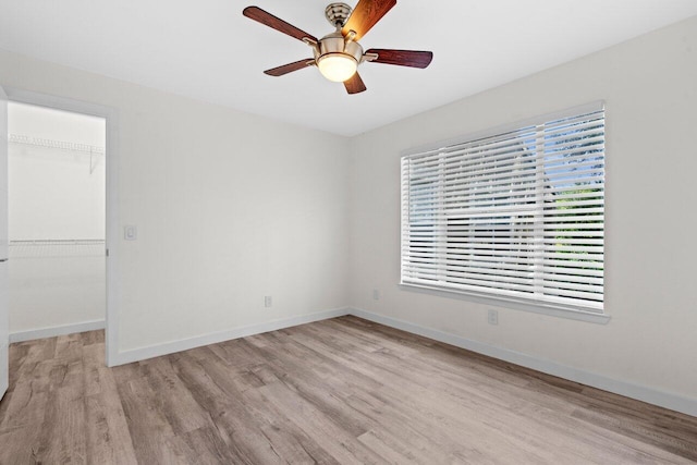 1825 Palm Cove Blvd Unit 7-307, Delray Beach, FL 33445 - unfurnished room featuring light wood-type flooring, plenty of natural light, and a ceiling fan