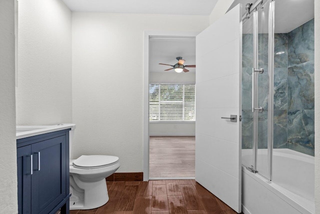 1825 Palm Cove Blvd Unit 7-307, Delray Beach, FL 33445 - full bath with vanity, wood finished floors, ceiling fan, enclosed tub / shower combo, and toilet