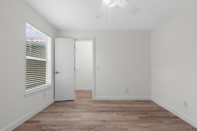 1825 Palm Cove Blvd Unit 7-307, Delray Beach, FL 33445 - unfurnished bedroom with wood finished floors, baseboards, and a ceiling fan