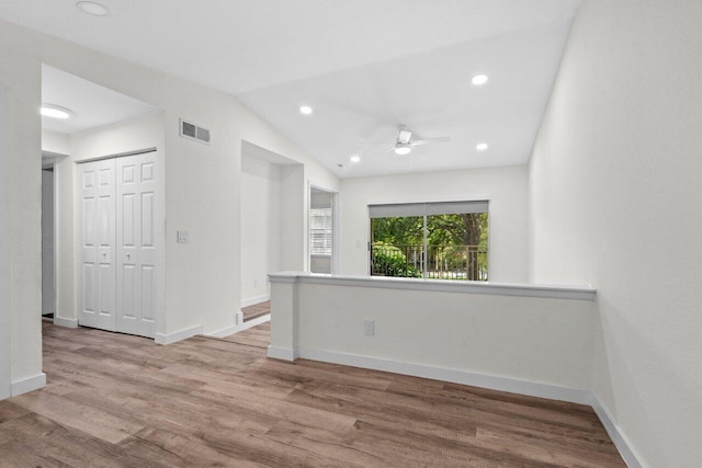 1825 Palm Cove Blvd Unit 7-307, Delray Beach, FL 33445 - empty room with a ceiling fan, wood finished floors, baseboards, recessed lighting, and vaulted ceiling