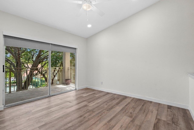 1825 Palm Cove Blvd Unit 7-307, Delray Beach, FL 33445 - spare room with wood finished floors, baseboards, a ceiling fan, and recessed lighting