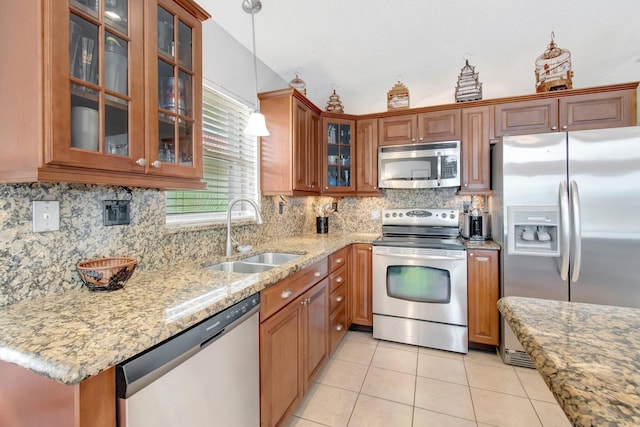 5630 Eagle Trace Ct, Lake Worth, FL 33463 - kitchen featuring stainless steel appliances, a sink, light tile patterned flooring, and light stone countertops