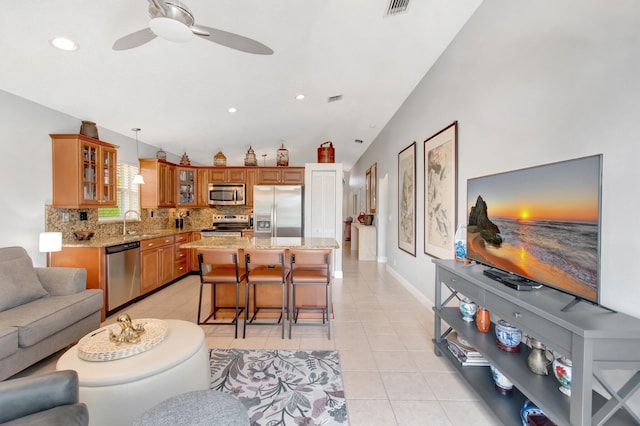 5630 Eagle Trace Ct, Lake Worth, FL 33463 - living room with light tile patterned flooring, a ceiling fan, recessed lighting, and baseboards