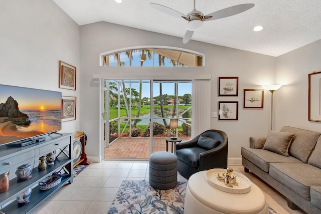 5630 Eagle Trace Ct, Lake Worth, FL 33463 - living area with a water view, ceiling fan, light tile patterned flooring, vaulted ceiling, and baseboards