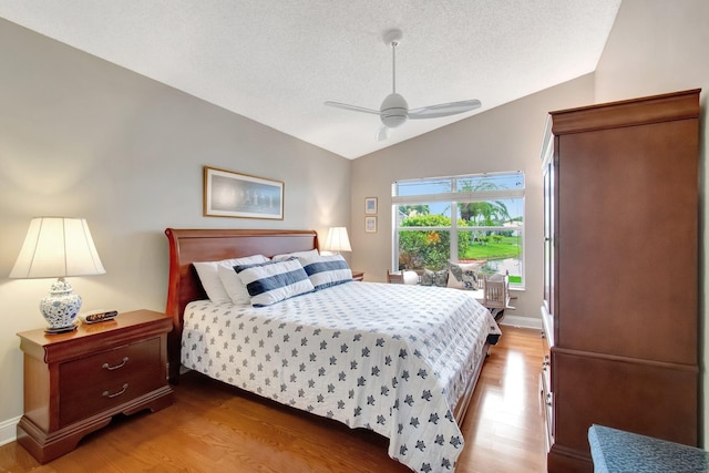 5630 Eagle Trace Ct, Lake Worth, FL 33463 - bedroom featuring vaulted ceiling, wood finished floors, a textured ceiling, a ceiling fan, and baseboards