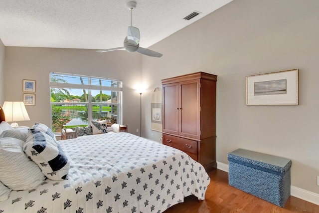 5630 Eagle Trace Ct, Lake Worth, FL 33463 - bedroom featuring lofted ceiling, wood finished floors, baseboards, a ceiling fan, and a textured ceiling