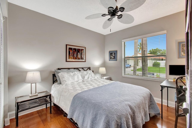 5630 Eagle Trace Ct, Lake Worth, FL 33463 - bedroom with wood finished floors, baseboards, and a ceiling fan