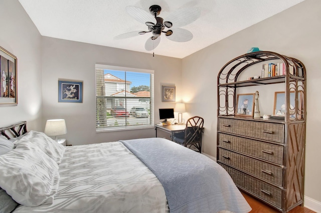 5630 Eagle Trace Ct, Lake Worth, FL 33463 - bedroom with baseboards, wood finished floors, and ceiling fan