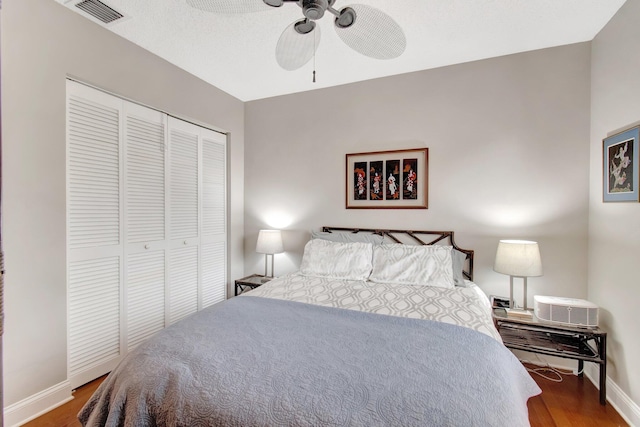 5630 Eagle Trace Ct, Lake Worth, FL 33463 - bedroom featuring wood finished floors, baseboards, a closet, and a ceiling fan