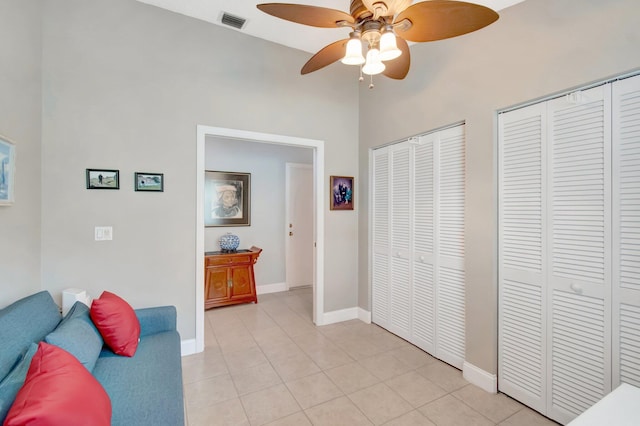 5630 Eagle Trace Ct, Lake Worth, FL 33463 - sitting room with a ceiling fan, light tile patterned floors, baseboards, and a high ceiling