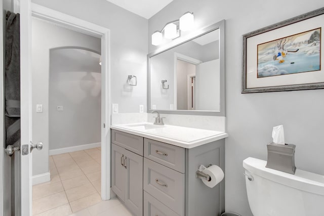 5630 Eagle Trace Ct, Lake Worth, FL 33463 - bathroom featuring toilet, vanity, tile patterned flooring, and baseboards
