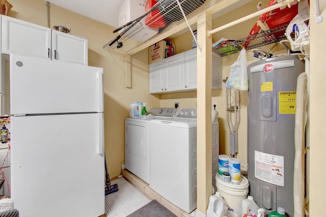 5630 Eagle Trace Ct, Lake Worth, FL 33463 - washroom featuring water heater, washing machine and clothes dryer, cabinet space, and light tile patterned floors