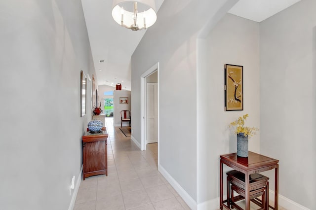 5630 Eagle Trace Ct, Lake Worth, FL 33463 - corridor featuring light tile patterned flooring, baseboards, and a chandelier