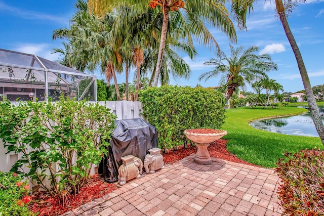 5630 Eagle Trace Ct, Lake Worth, FL 33463 - view of patio / terrace featuring a water view, a lanai, and a grill