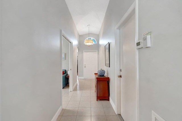 5630 Eagle Trace Ct, Lake Worth, FL 33463 - corridor featuring light tile patterned flooring, baseboards, and vaulted ceiling