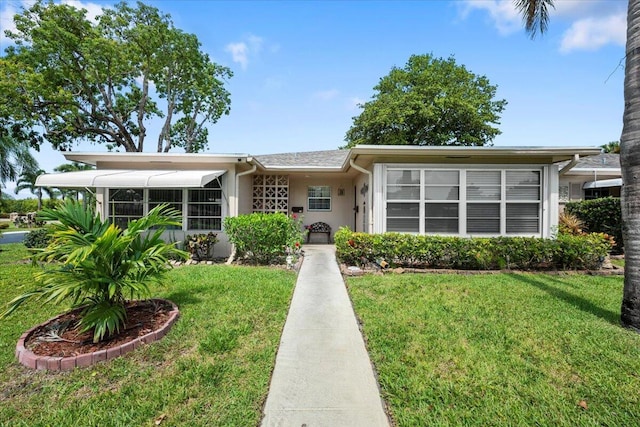 1422 High Point Way NW Unit B, Delray Beach, FL 33445 - ranch-style home with a front yard and stucco siding