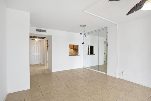 4500 N Federal Hwy Unit 367H, Lighthouse Point, FL 33064 - empty room with light tile patterned floors and ceiling fan