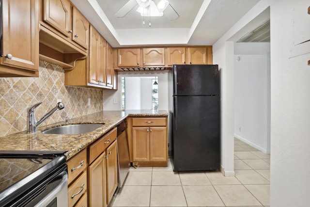 4500 N Federal Hwy Unit 367H, Lighthouse Point, FL 33064 - kitchen with freestanding refrigerator, ceiling fan, light stone countertops, light tile patterned floors, and decorative backsplash