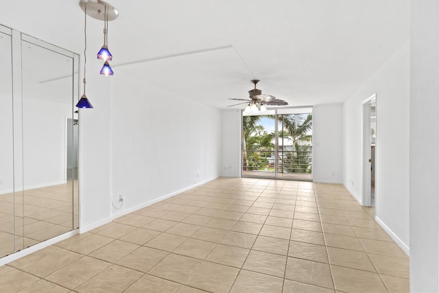 4500 N Federal Hwy Unit 367H, Lighthouse Point, FL 33064 - unfurnished room with expansive windows, a ceiling fan, and light tile patterned flooring