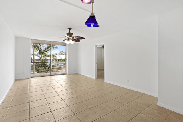 4500 N Federal Hwy Unit 367H, Lighthouse Point, FL 33064 - spare room featuring light tile patterned floors, ceiling fan, and floor to ceiling windows