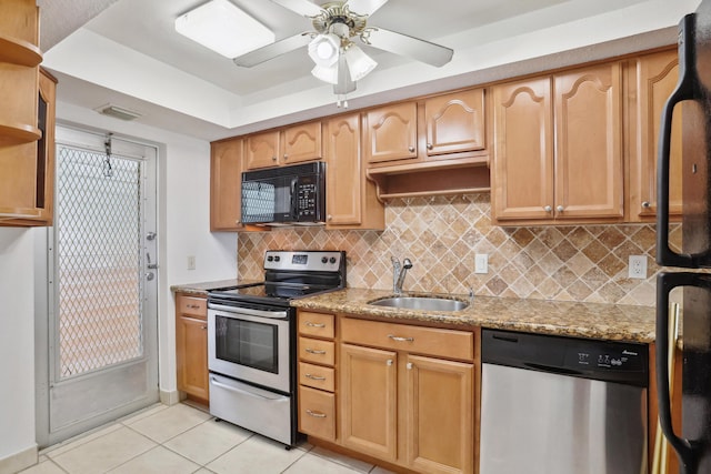 4500 N Federal Hwy Unit 367H, Lighthouse Point, FL 33064 - kitchen with black appliances, light tile patterned flooring, backsplash, light stone counters, and ceiling fan