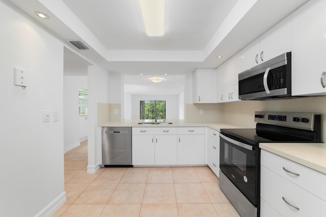 16091 Blatt Blvd Unit 302, Weston, FL 33326 - kitchen with appliances with stainless steel finishes, light countertops, light tile patterned floors, and recessed lighting