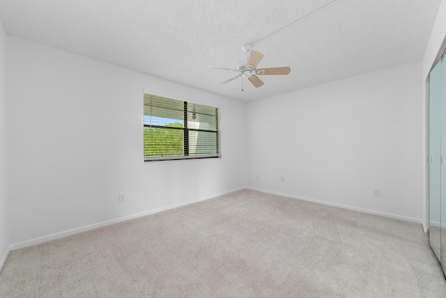 16091 Blatt Blvd Unit 302, Weston, FL 33326 - spare room with carpet floors, a ceiling fan, baseboards, and a textured ceiling