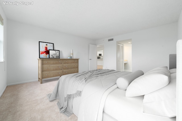 16091 Blatt Blvd Unit 302, Weston, FL 33326 - bedroom with light carpet, baseboards, and ensuite bathroom