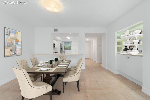 16091 Blatt Blvd Unit 302, Weston, FL 33326 - dining room with light tile patterned flooring and baseboards