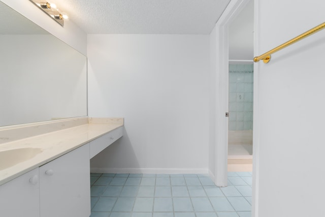 16091 Blatt Blvd Unit 302, Weston, FL 33326 - bathroom featuring vanity, tile patterned flooring, a textured ceiling, and baseboards