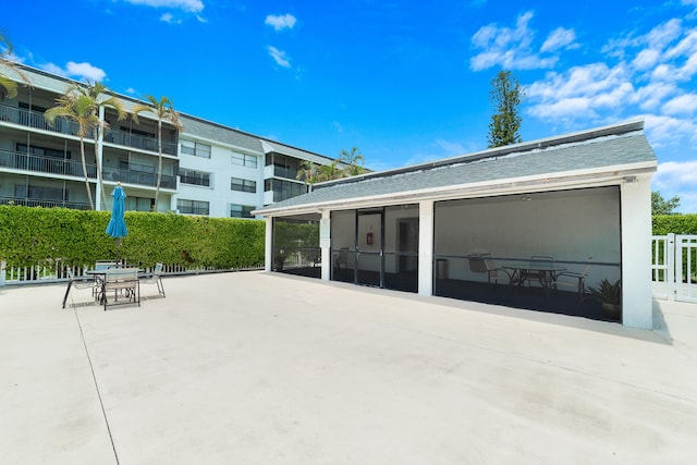 16091 Blatt Blvd Unit 302, Weston, FL 33326 - back of house with a patio, outdoor dining space, and a sunroom
