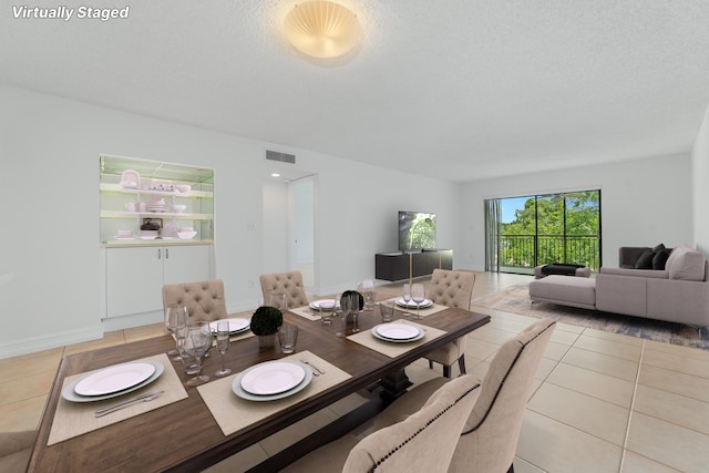 16091 Blatt Blvd Unit 302, Weston, FL 33326 - dining area featuring light tile patterned floors