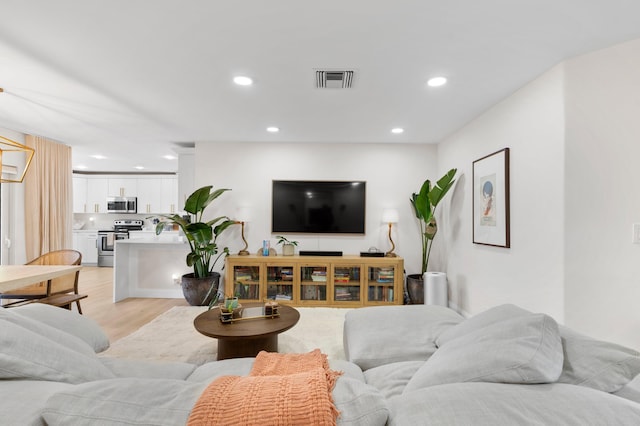 1701 N Ocean Breeze, Lake Worth Beach, FL 33460 - living area with light wood-style floors and recessed lighting