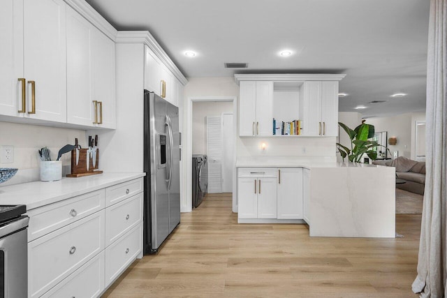 1701 N Ocean Breeze, Lake Worth Beach, FL 33460 - kitchen with stainless steel fridge with ice dispenser, white cabinets, light countertops, light wood-style floors, and recessed lighting
