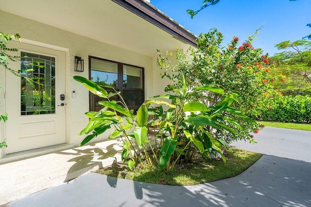 1701 N Ocean Breeze, Lake Worth Beach, FL 33460 - view of exterior entry featuring stucco siding