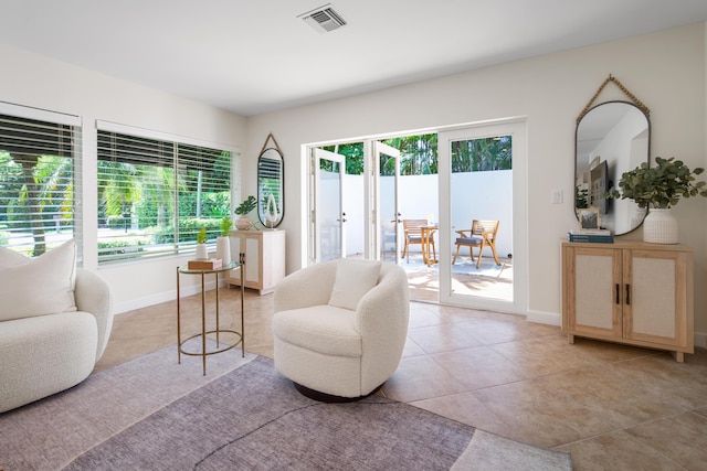 330 SE 7th Ave, Delray Beach, FL 33483 - sitting room with plenty of natural light, light tile patterned flooring, french doors, and baseboards