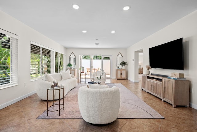 330 SE 7th Ave, Delray Beach, FL 33483 - living room featuring light tile patterned floors, baseboards, and recessed lighting