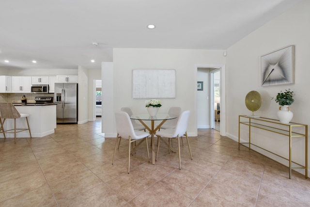 330 SE 7th Ave, Delray Beach, FL 33483 - dining space with light tile patterned floors, recessed lighting, plenty of natural light, and baseboards
