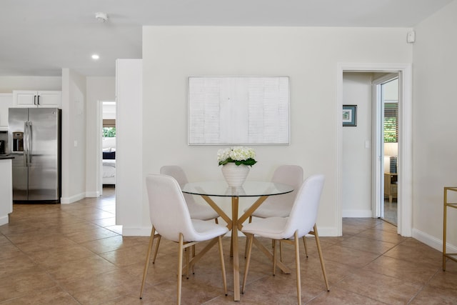 330 SE 7th Ave, Delray Beach, FL 33483 - dining room with healthy amount of natural light, light tile patterned flooring, recessed lighting, and baseboards