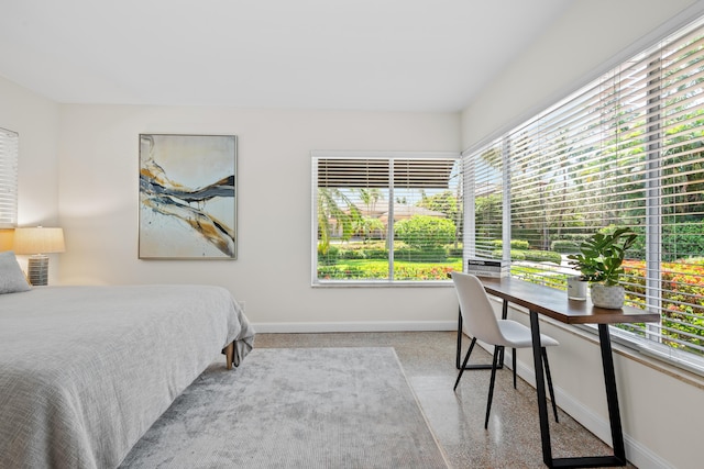 330 SE 7th Ave, Delray Beach, FL 33483 - bedroom with baseboards, speckled floor, and a desk