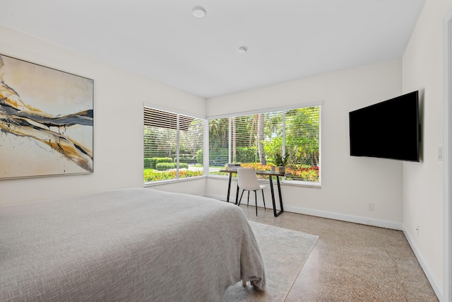 330 SE 7th Ave, Delray Beach, FL 33483 - bedroom with multiple windows, baseboards, and speckled floor