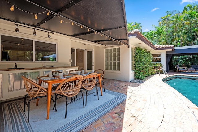 330 SE 7th Ave, Delray Beach, FL 33483 - deck featuring a patio, an outdoor pool, and outdoor dining area
