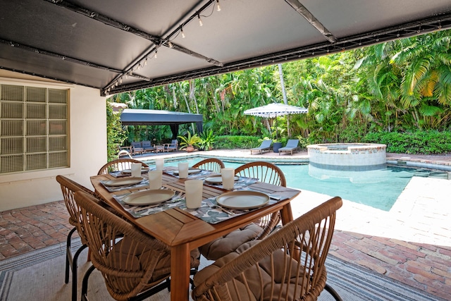 330 SE 7th Ave, Delray Beach, FL 33483 - view of pool with a patio, outdoor dining area, and a pool with connected hot tub