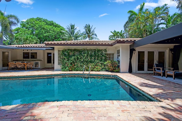 330 SE 7th Ave, Delray Beach, FL 33483 - outdoor pool featuring french doors and a patio