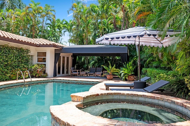 330 SE 7th Ave, Delray Beach, FL 33483 - view of pool with french doors, a patio area, a gazebo, and a pool with connected hot tub