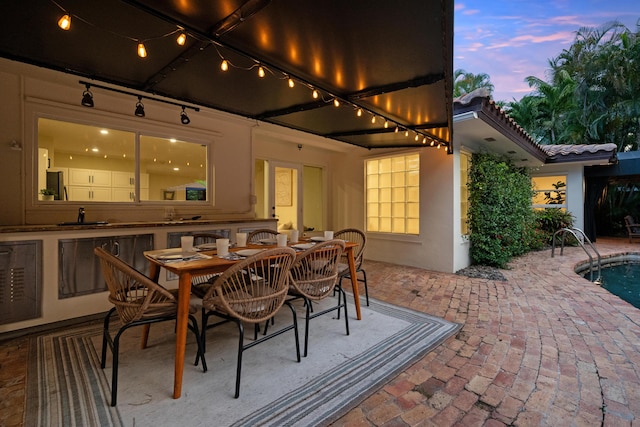 330 SE 7th Ave, Delray Beach, FL 33483 - view of patio featuring an outdoor pool, outdoor dining space, and a sink