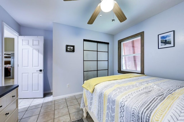 3725 SE Middle St, Stuart, FL 34997 - bedroom with light tile patterned floors, a ceiling fan, and baseboards