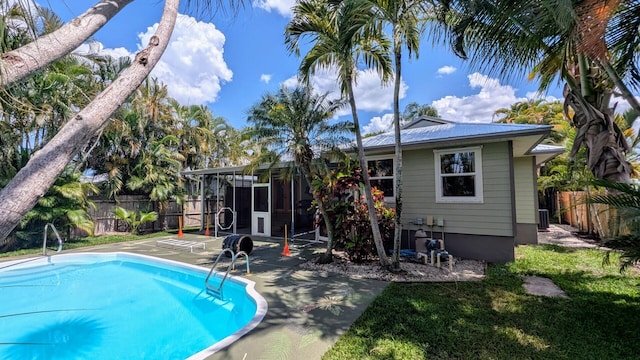 3725 SE Middle St, Stuart, FL 34997 - view of pool with a sunroom and a patio area