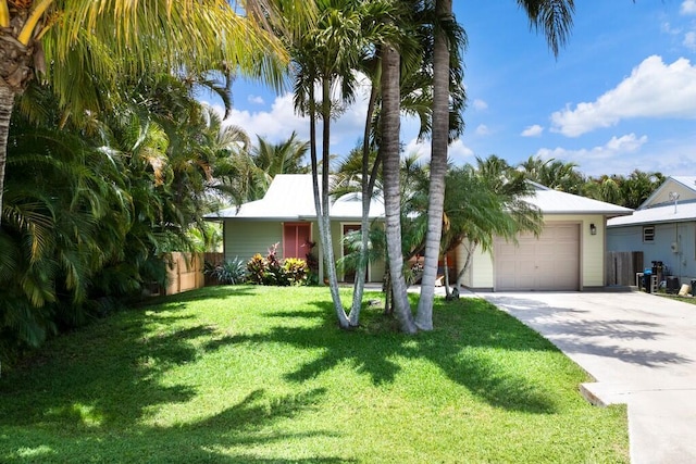3725 SE Middle St, Stuart, FL 34997 - view of front facade with driveway and an attached garage